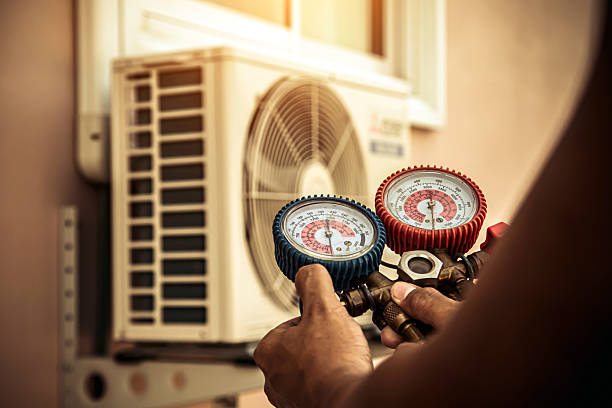 Professional Air Conditioning Service technician working in East Norwich, NY